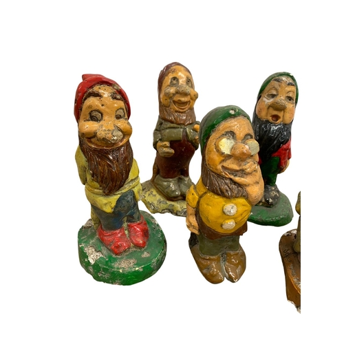 1006 - Collection of vintage Snow White and the seven dwarfs garden gnomes, each being stamped 'Disney' to ... 