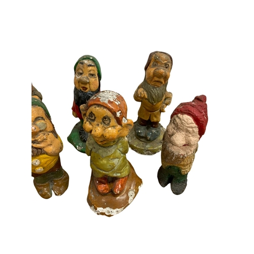 1006 - Collection of vintage Snow White and the seven dwarfs garden gnomes, each being stamped 'Disney' to ... 