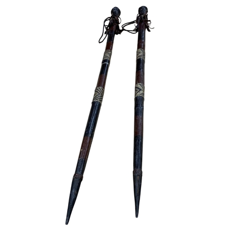 291 - Pair of African tribal hog-sticking hunting spears, having decorative leather wrap and  tassled hand... 