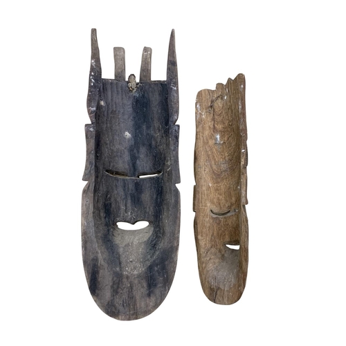 297 - Two large African tribal hand carved wall masks, one having intricate bone inlay to face, largest L ... 