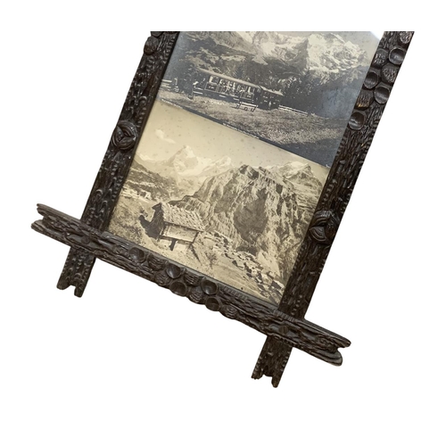 1541 - Hand carved antique Folk Art wooden picture frame, displaying a quantity of Swiss Mountain scene pho... 