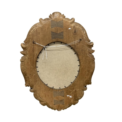 1184 - Well carved wooden wall mirror, having intricate mythical face and scrolled acanthus leaf border, 75... 