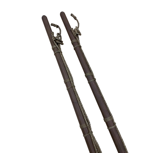 568 - Unusual pair of wooden and rope bound whale harpoons, L 170cm