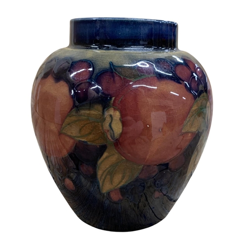 399 - Moorcroft Pottery Pomegranate pattern floral vase, signed to base, H 14cm