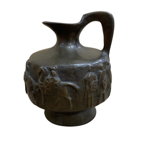 502 - Heavy bronze archaic style ewer jug, having battlescene relief throughout, H 19cm