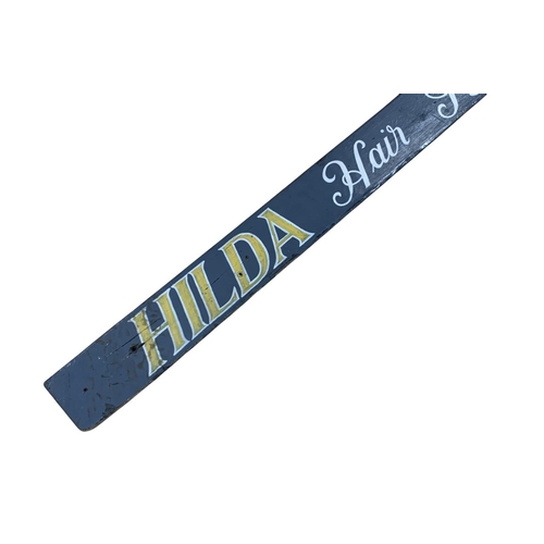 1051 - Advertising - hand painted 'Hilda Hair Stylist' wooden sign, 88cm x 13cm