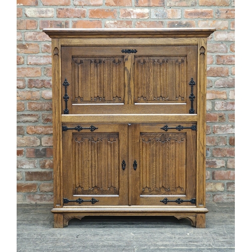 1220 - 20th century oak drinks cabinet with fall front and carved linen fold detail, H 132cm x W 110cm x D ... 