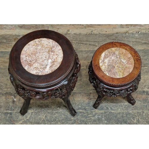 1233 - Two Chinese hardwood stands with inset marble tops and carved floral detail, H 45cm x diameter 36cm ... 