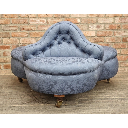 1238 - Good Victorian three seat conversation sofa with button back upholstery raised on brass castors, H 7... 