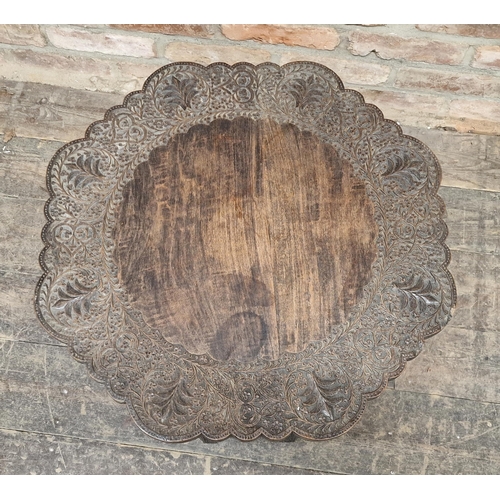 1243 - 19th century Indian hardwood side table with profusely carved detail, H 54cm x W 57cm