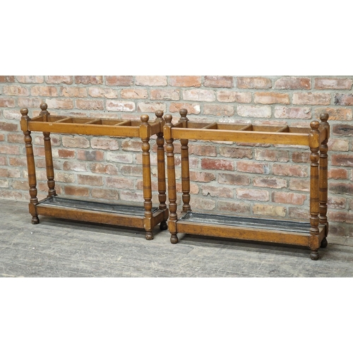 1256 - Pair of antique oak country house umbrella / stick stands with drip trays, raised on turned supports... 