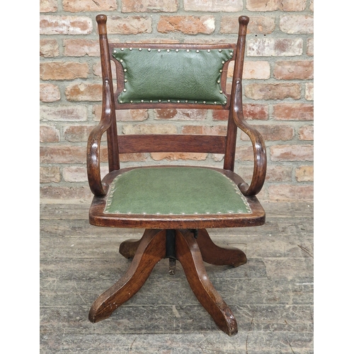 1297 - Edwardian oak revolving desk chair with studded leather pad seat and back, H 89cm