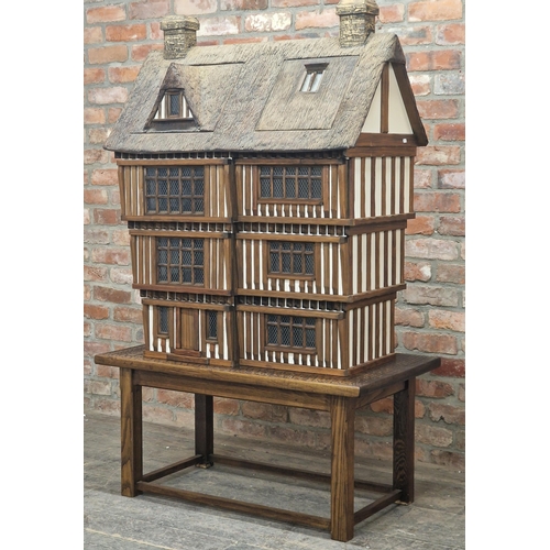 1300 - Robert Stubbs - Impressive bespoke Tudor style dolls house complete with contents raised on bespoke ... 