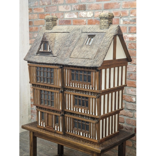 1300 - Robert Stubbs - Impressive bespoke Tudor style dolls house complete with contents raised on bespoke ... 