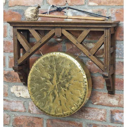 1301 - Antique Anglo-Japanese brass gong in an oak frame with striker, H 38cm x W 59cm x D 16cm