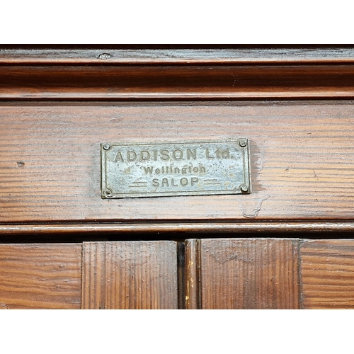 1320 - Antique pitch pine housekeepers cabinet with shelved interior stamped 'ADDISON Ltd, Wellington', H 2... 