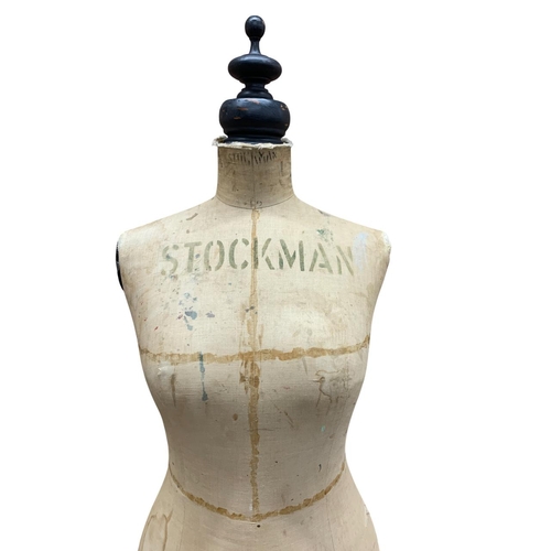 596 - Stockman of Paris - female dress mannequin raised on a quadruped iron base with metal castors, stamp... 