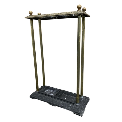 503 - Antique brass and cast iron base stick stand, having original inserts to base, H 65cm x W 45cm x D 1... 