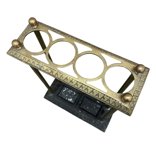 503 - Antique brass and cast iron base stick stand, having original inserts to base, H 65cm x W 45cm x D 1... 