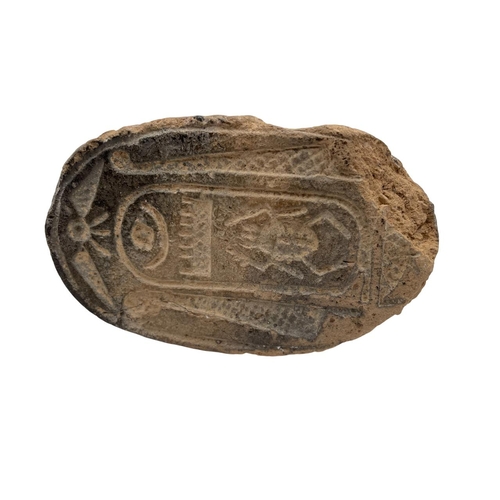 187 - An ancient Egyptian pottery seal in the form of a scarab beetle with sphinx head, hieroglyphic carvi... 