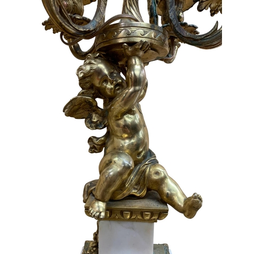 1143 - Pair of impressive 19th century French ormolu table lamps, each designed as a cherub supporting four... 