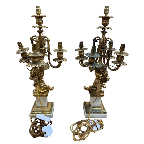 1143 - Pair of impressive 19th century French ormolu table lamps, each designed as a cherub supporting four... 