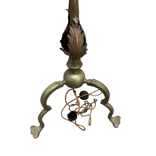 1170 - Antique brass twisted stem standard lamp, having applied acanthus leaf detail with three footed pawb... 