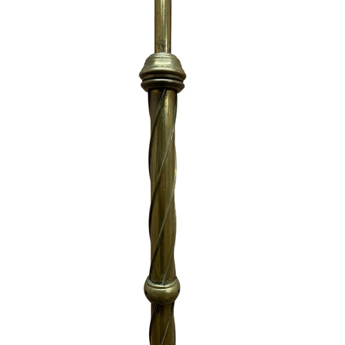 1170 - Antique brass twisted stem standard lamp, having applied acanthus leaf detail with three footed pawb... 