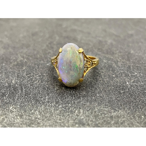 22 - 18ct opal and diamond dress ring, central opal 15 x 9mm, flanked with six .03ct diamonds, size K, 4.... 