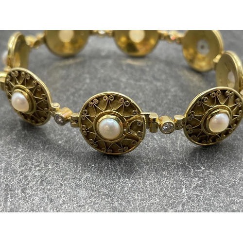 38 - Circle of Theo Fennel - 18ct pearl and diamond Etruscan style panel bracelet, each circular filigree... 