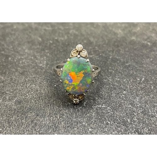 43 - Impressive antique black opal and diamond oval cluster ring, the opal 17 x 14mm approx, size P/Q, 4.... 