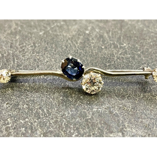 46 - Good white gold diamond and sapphire cross-over brooch, central 1ct diamond and sapphire flanked by ... 