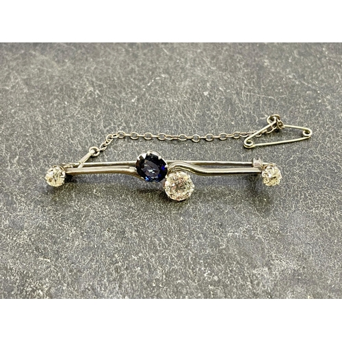 46 - Good white gold diamond and sapphire cross-over brooch, central 1ct diamond and sapphire flanked by ... 