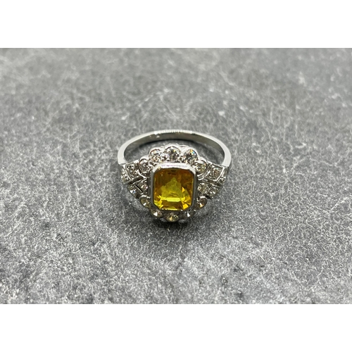 60 - Good quality platinum, yellow sapphire and diamond cluster ring, the sapphire 2ct, size M/N, 4.5g