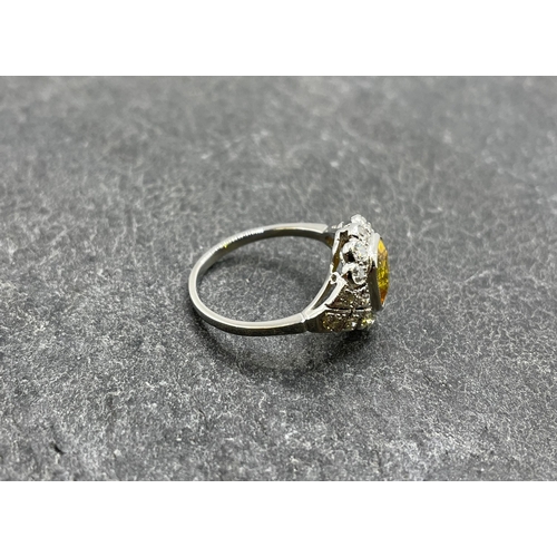 60 - Good quality platinum, yellow sapphire and diamond cluster ring, the sapphire 2ct, size M/N, 4.5g