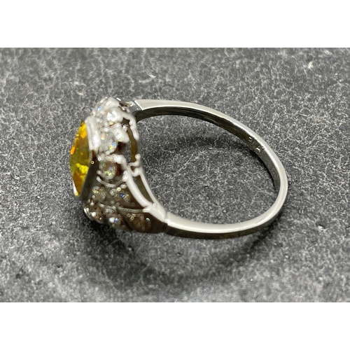 60 - Good quality platinum, yellow sapphire and diamond cluster ring, the sapphire 2ct, size M/N, 4.5g