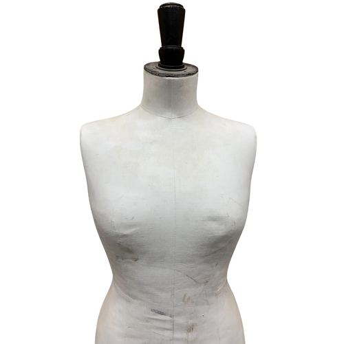 603 - Stockman of Paris - Vintage female canvas mannequin mounted on tri-footed metal base, H 145cm