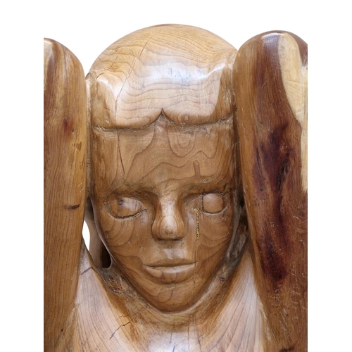 1476 - Carved yew wood sculpture of a nude woman raised on a chamfered square cut base, H 142cm