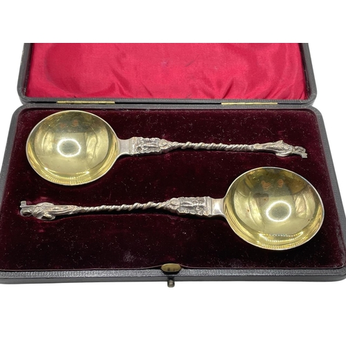 128 - Pair of Edwardian silver anointing apostle spoons, gilt bowls and cast handles, maker John Millward ... 