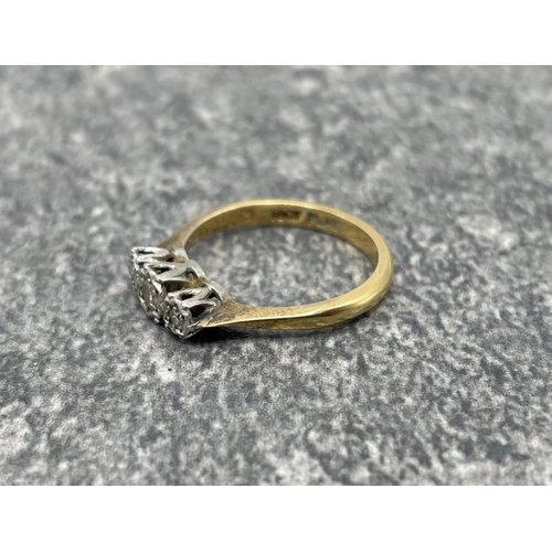 95 - Mid 20th century gold and diamond three stone illusion ring. The graduated eight-cut stones all grai... 