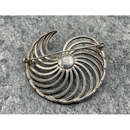 97 - Borge Malling Jensen, a vintage Danish sterling spiral brooch, centred with a hemi-spherical bead wi... 