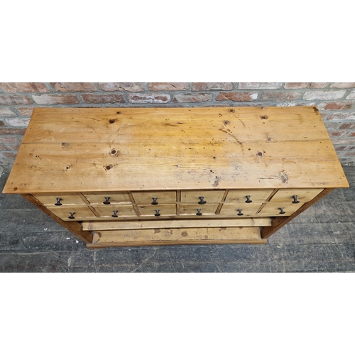 1349 - Antique pine bank of twelve drawers with under shelf, H 97cm x W 118cm x D 37cm