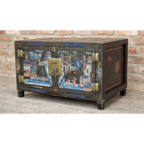 1351 - Chinese black painted cabinet with Chinoiserie detail, the two cupboard doors enclosing two drawers,... 