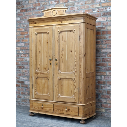 1357 - 20th century pine double wardrobe with two drawers to base, H 193cm x W 122cm x D 52cm