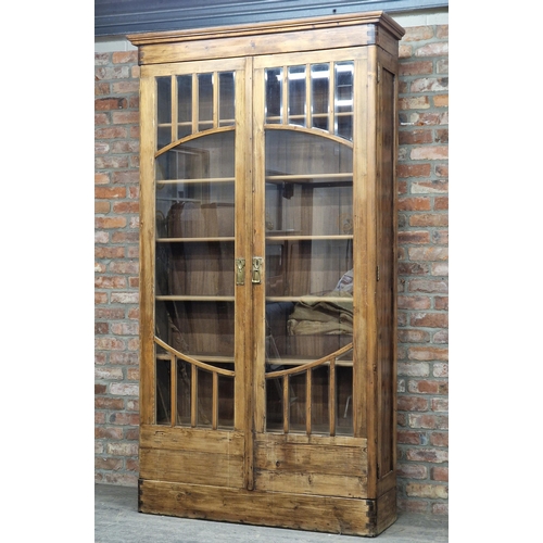 1358 - Large stained pine display cabinet or bookcase with two glazed cupboard doors, fitted with six shelv... 