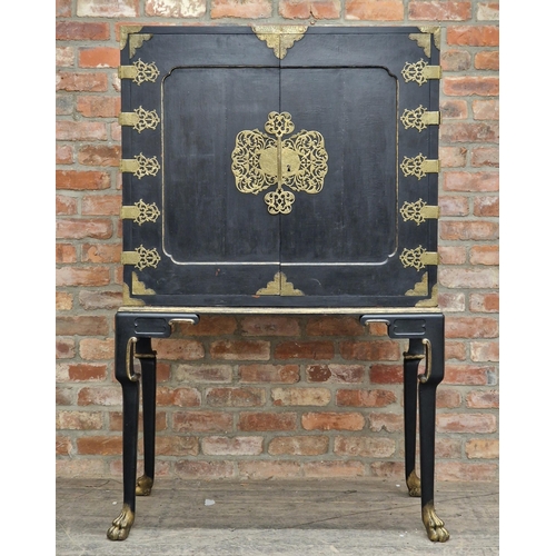 1384 - 20th century Chinese ebonised cabinet on stand with gilt metal mounts and mirrored shelved interior,... 