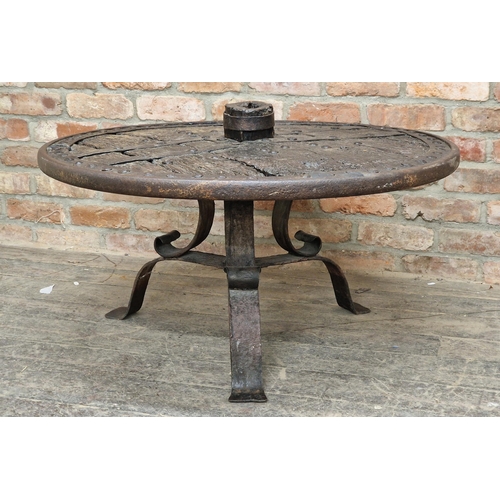 1388 - 17th century oak and wrought iron cartwheel table raised on a scrolled base, H 60cm x W 100cm