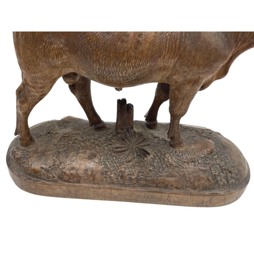 445 - Expertly carved Black Forest standing bull, on a naturalistic base, 17 x 18cm