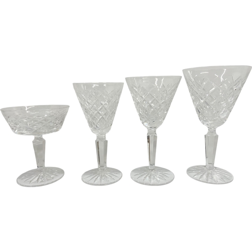 408 - Exstensive collection of Waterford crystal drinking glasses to include champagne and wine glasses, l... 