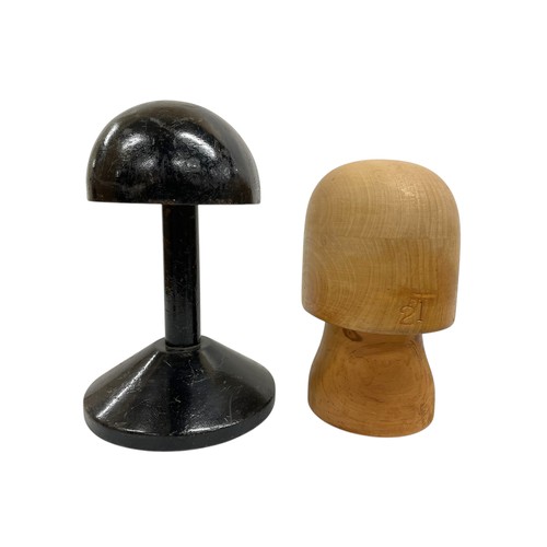 607 - Two wooden milliners hat stands / moulds, tallest 32cm. (2)